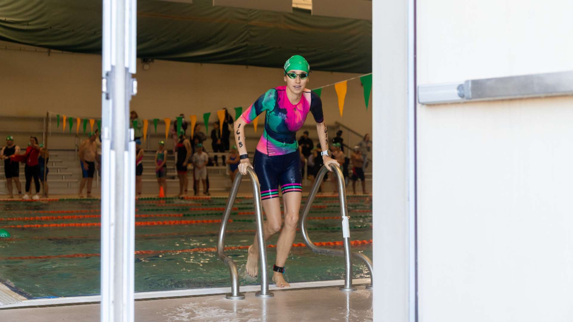 Photo of a Triathlon Participant exiting the pool